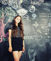 Image showing back to school after summer vacations, cute teen girl in classroom