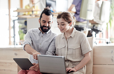 Image showing creative team with tablet pc and laptop in office