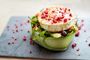 Image showing goat cheese salad with vegetables at restaurant