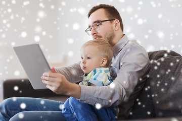 Image showing father and son with tablet pc playing at home