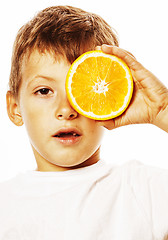 Image showing little cute boy with orange fruit double isolated on white smili