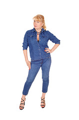 Image showing Woman in jeans clothing standing.