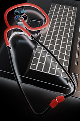 Image showing silver laptop diagnosis with stethoscope. 3D illustration