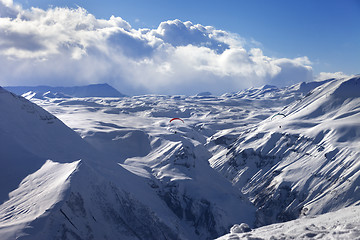 Image showing Speed flying in sun winter mountains