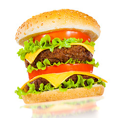 Image showing Tasty and appetizing hamburger on a white