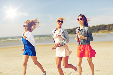 Image showing group of smiling women in sunglasses on beach