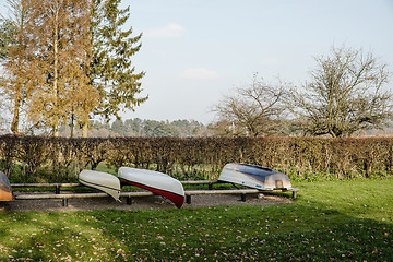 Image showing Boats on a row on land