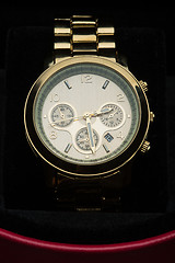 Image showing gold watch isolated on black background