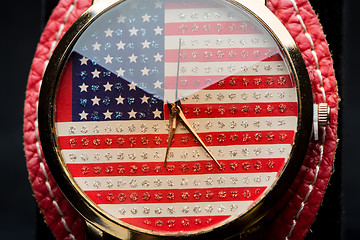 Image showing clock on a black background. American Flag