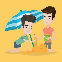 Image showing Male friends building sandcastle on beach.