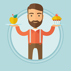 Image showing Man choosing between apple and cupcake.