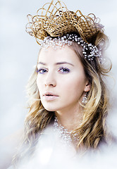 Image showing beauty young snow queen in fairy flashes with crown on her head