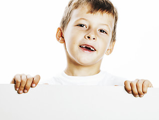 Image showing little cute boy holding empty shit to copyspace isolated close u