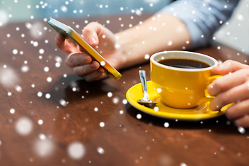 Image showing woman with smartphone drinking coffee at cafe