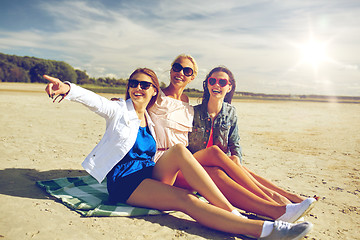 Image showing group of smiling women in sunglasses on beach