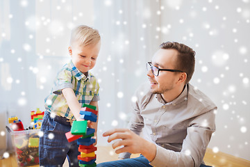 Image showing father and son playing with toy blocks at home