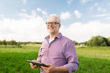 Image showing senior man with tablet pc computer at county