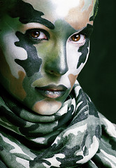 Image showing Beautiful young fashion woman with military style clothing and face paint make-up, khaki colored