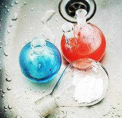 Image showing waste products in laboratory, medicine-glass with colored red and blue liquid