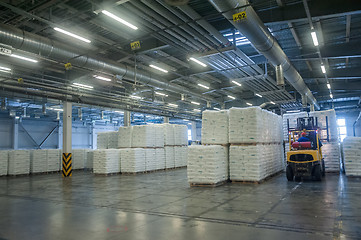 Image showing Forklift truck loads pallets with finished goods