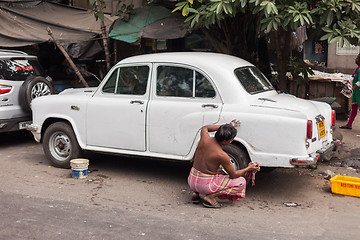 Image showing Man washing car