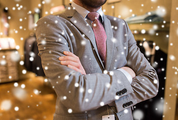 Image showing close up of man in suit and tie at clothing store