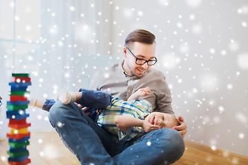 Image showing father with son playing and having fun at home