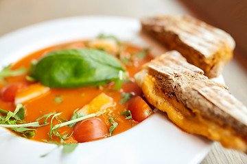 Image showing close up of gazpacho soup with bread at restaurant