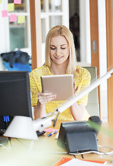 Image showing happy creative woman with tablet pc at office