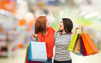 Image showing teenage girls with shopping bags and credit card