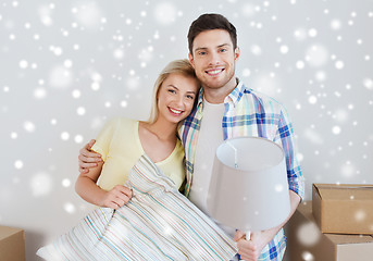 Image showing happy couple with stuff moving to new home