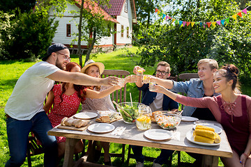 Image showing happy friends having party at summer garden