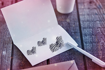 Image showing Envelope with black heart for valentine day on wooden background