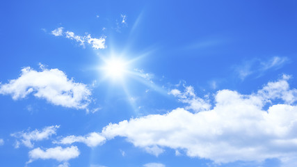 Image showing blue sky with some clouds and the sun
