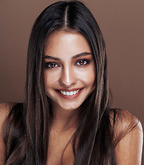 Image showing cute happy young indian woman in studio close up smiling, fashion mulatto emotional posing, lifestyle people concept