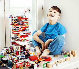 Image showing little cute preschooler boy playing toys at home happy smiling, 