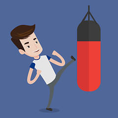 Image showing Man exercising with punching bag.