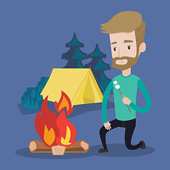 Image showing Businessman roasting marshmallow over campfire.