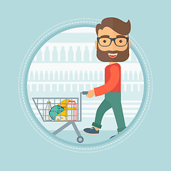 Image showing Customer walking in store with shopping trolley.