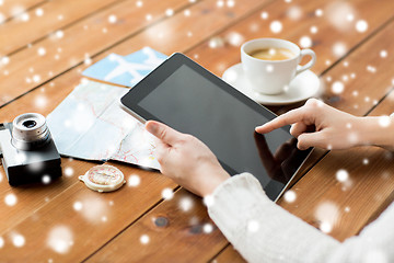 Image showing close up of traveler hands with tablet pc and map