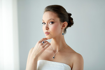 Image showing beautiful woman with earring, ring and pendant