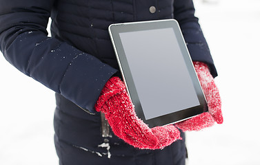 Image showing close up of woman with tablet pc in winter