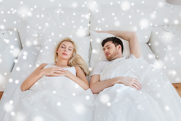 Image showing happy couple sleeping in bed at home