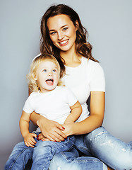 Image showing mother with daughter together in bed smiling, happy family close