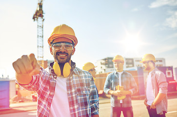 Image showing builders pointing finger at you on construction