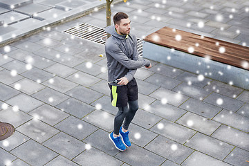 Image showing man exercising with jump-rope outdoors