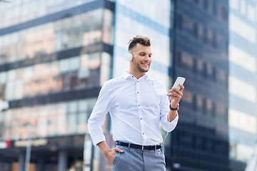 Image showing man with headphones and smartphone listening music