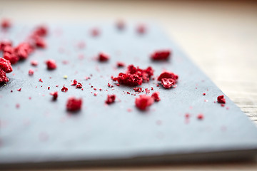 Image showing dried raspberries or berries on stone plate