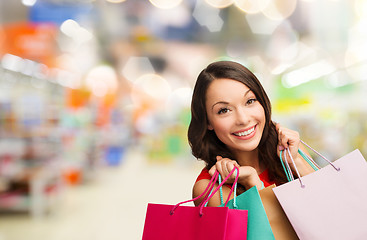 Image showing woman with shopping bags at store