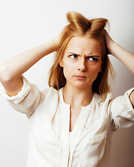 Image showing young blond woman on white backgroung gesture thumbs up, isolate